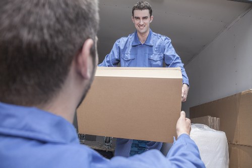 Removal team loading furniture for a Camden home move