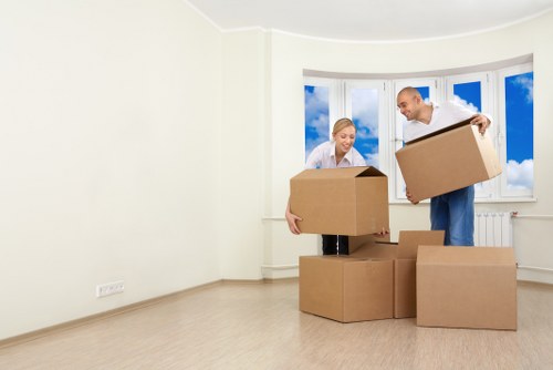 Packers handling fragile household items with care
