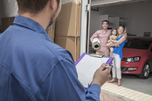 Camden relocation scene with movers transporting boxes carefully