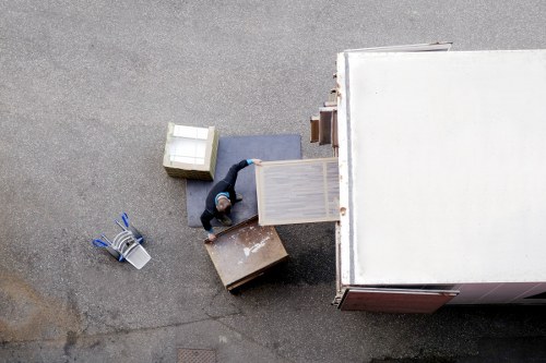 Furniture and office items being transported with a Camden moving truck