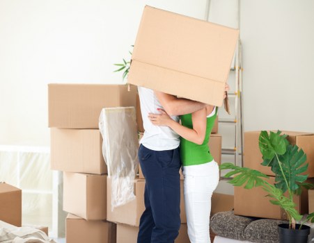 Professional movers loading household items for a Camden move