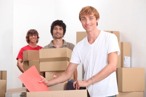 Professional removal company handling furniture in a Camden home